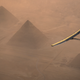 Solar Impulse flying over the Great Pyramids.